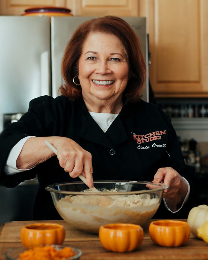 Chef Linda Orcutt mixing in her kitchen